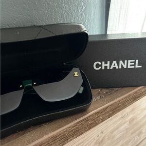 CHANEL Elegant Black Sunglasses with Gold Detail